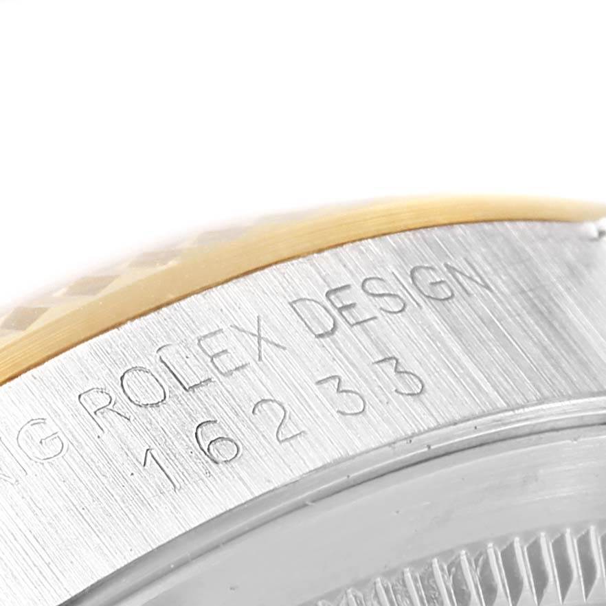The image shows a close-up view of the serial number engraving on the bezel and case side of a Rolex Datejust 16233 Men's Steel and Gold (two tone) Beige Dial 16233 Men's Steel and Gold (two tone) Beige Dial watch.