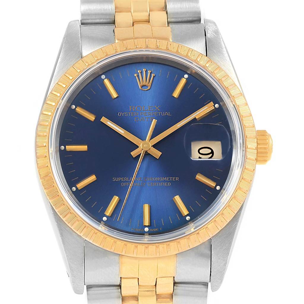 The image shows a front angle of a Rolex Datejust 15223 Men's Steel and Gold (two tone) Blue Dial 15223 Men's Steel and Gold (two tone) Blue Dial watch, highlighting its blue dial, gold bezel, and two-tone bracelet.