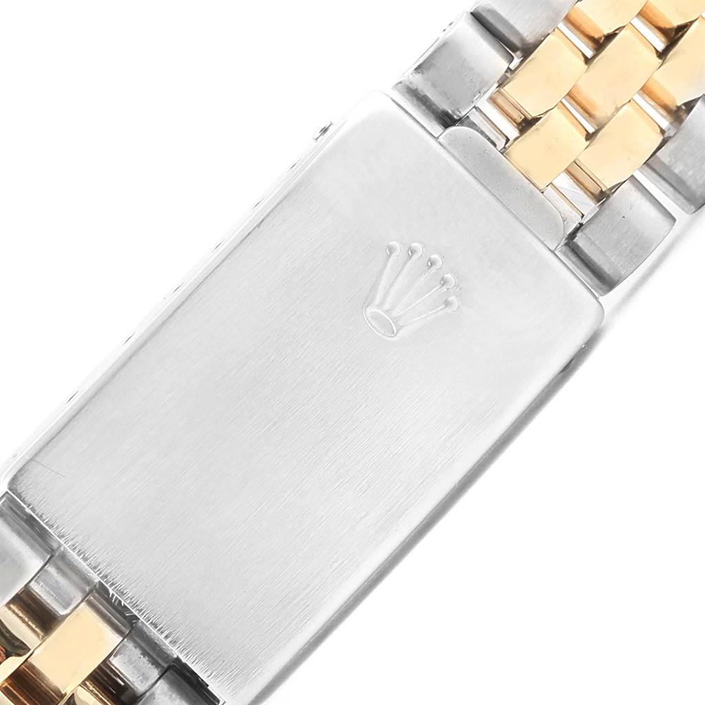 The image shows a close-up of the clasp of a Rolex Datejust 15223 Men's Steel and Gold (two tone) Blue Dial 15223 Men's Steel and Gold (two tone) Blue Dial watch, highlighting the brand's logo.