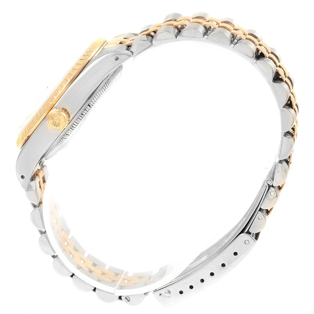 The image shows a side view of a Rolex Datejust 15223 Men's Steel and Gold (two tone) Blue Dial 15223 Men's Steel and Gold (two tone) Blue Dial watch, highlighting its bezel, crown, and two-tone bracelet.