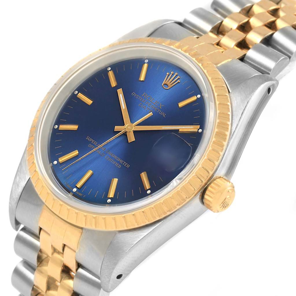 The image shows a Rolex Datejust 15223 Men's Steel and Gold (two tone) Blue Dial 15223 Men's Steel and Gold (two tone) Blue Dial watch angled to display its face, bezel, and part of the bracelet.