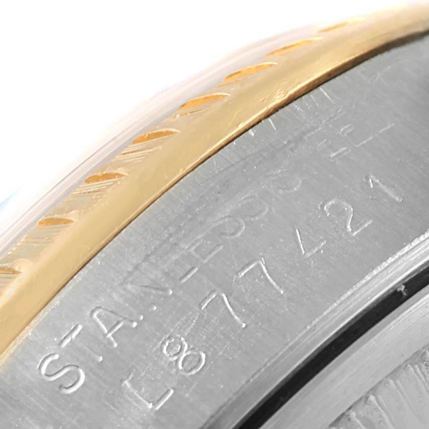 The image shows a close-up angle of the bezel and the engraved serial number on a Rolex Datejust 15223 Men's Steel and Gold (two tone) Blue Dial 15223 Men's Steel and Gold (two tone) Blue Dial watch.
