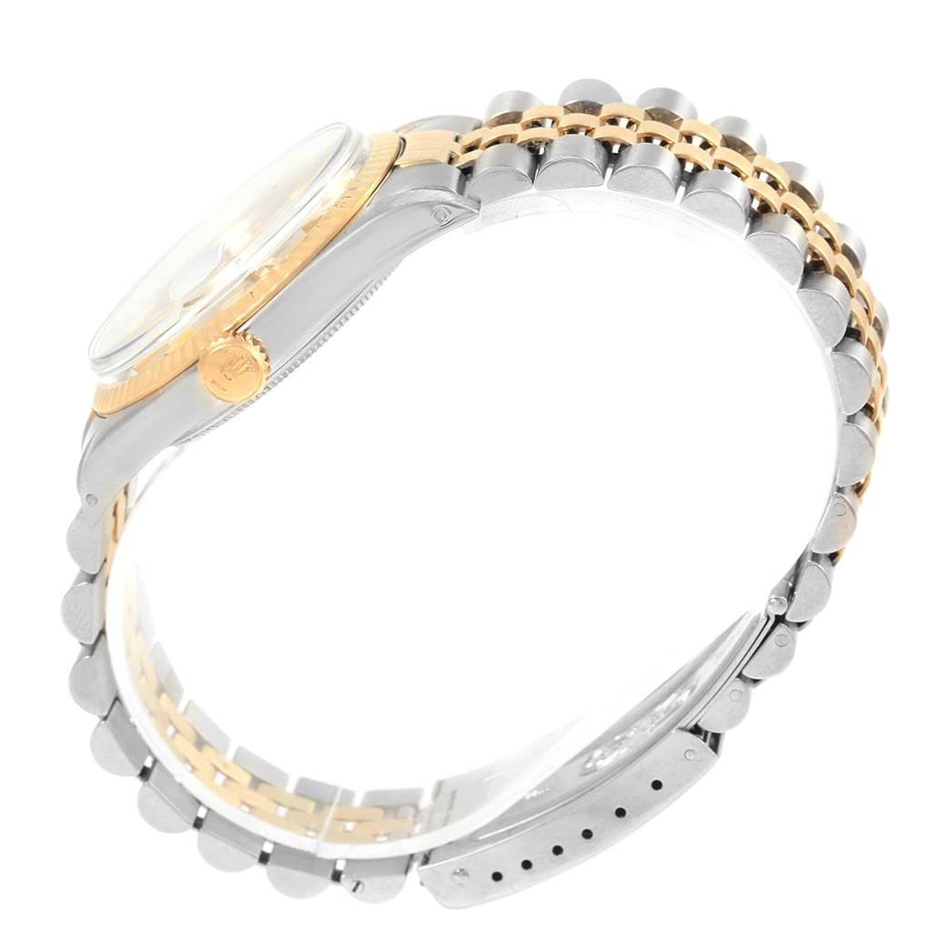 The image shows a side view of a Rolex Datejust 1601 Men's Stainless Steel Silver Dial 1601 Men's Stainless Steel Silver Dial watch featuring the crown, case, and bracelet.