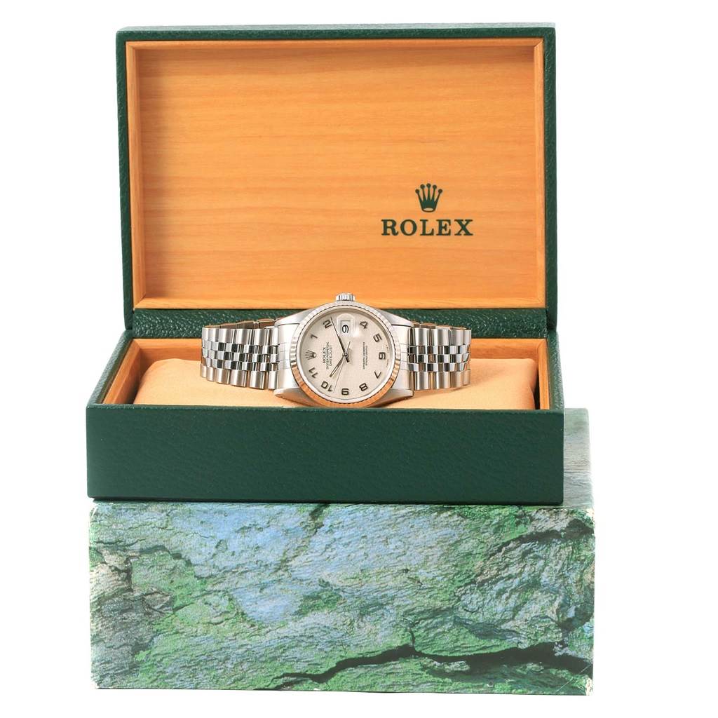 The Rolex Datejust 16234 Men's Stainless Steel Beige Dial 16234 Men's Stainless Steel Beige Dial watch is showcased in its open box, displaying the dial and bracelet from a front view.