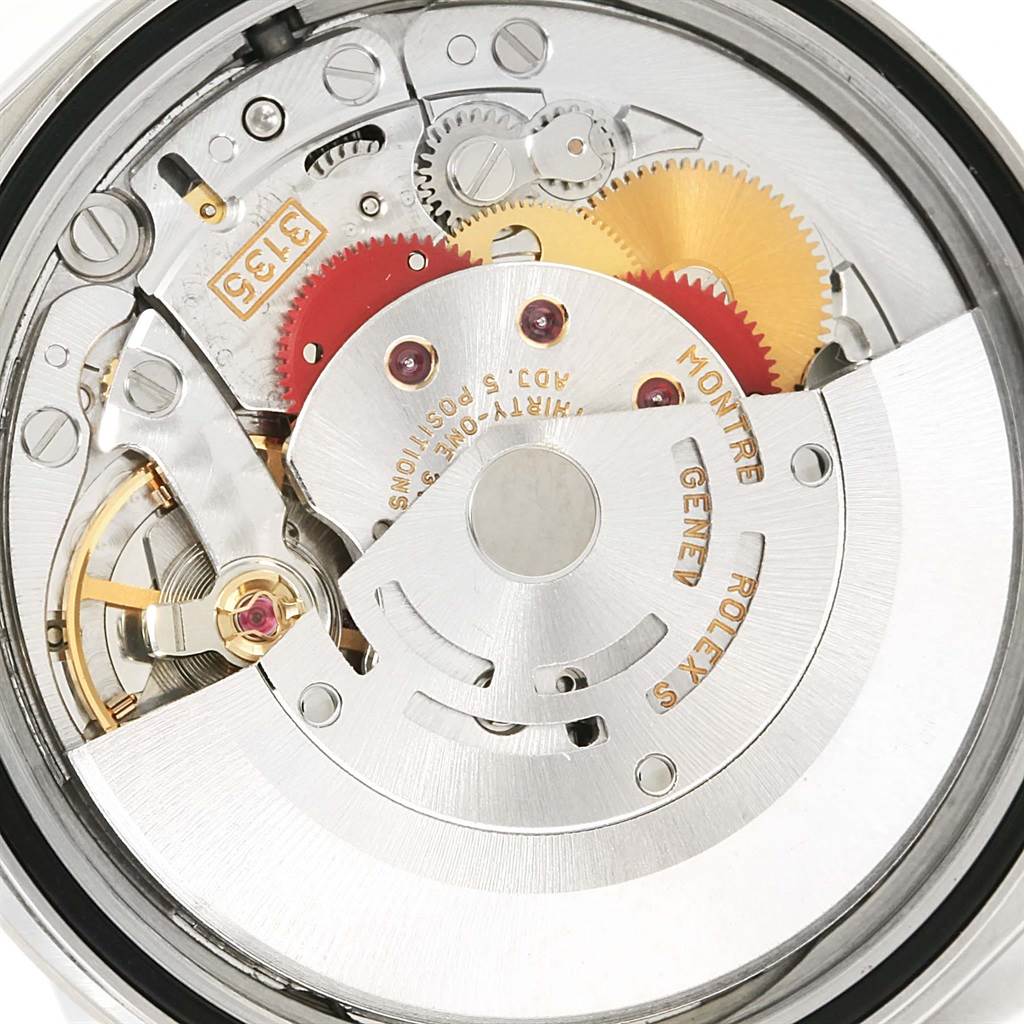 This image shows a close-up view of the internal mechanism of a Rolex Datejust 16234 Men's Stainless Steel Beige Dial 16234 Men's Stainless Steel Beige Dial watch, highlighting its intricate gears and rotor.
