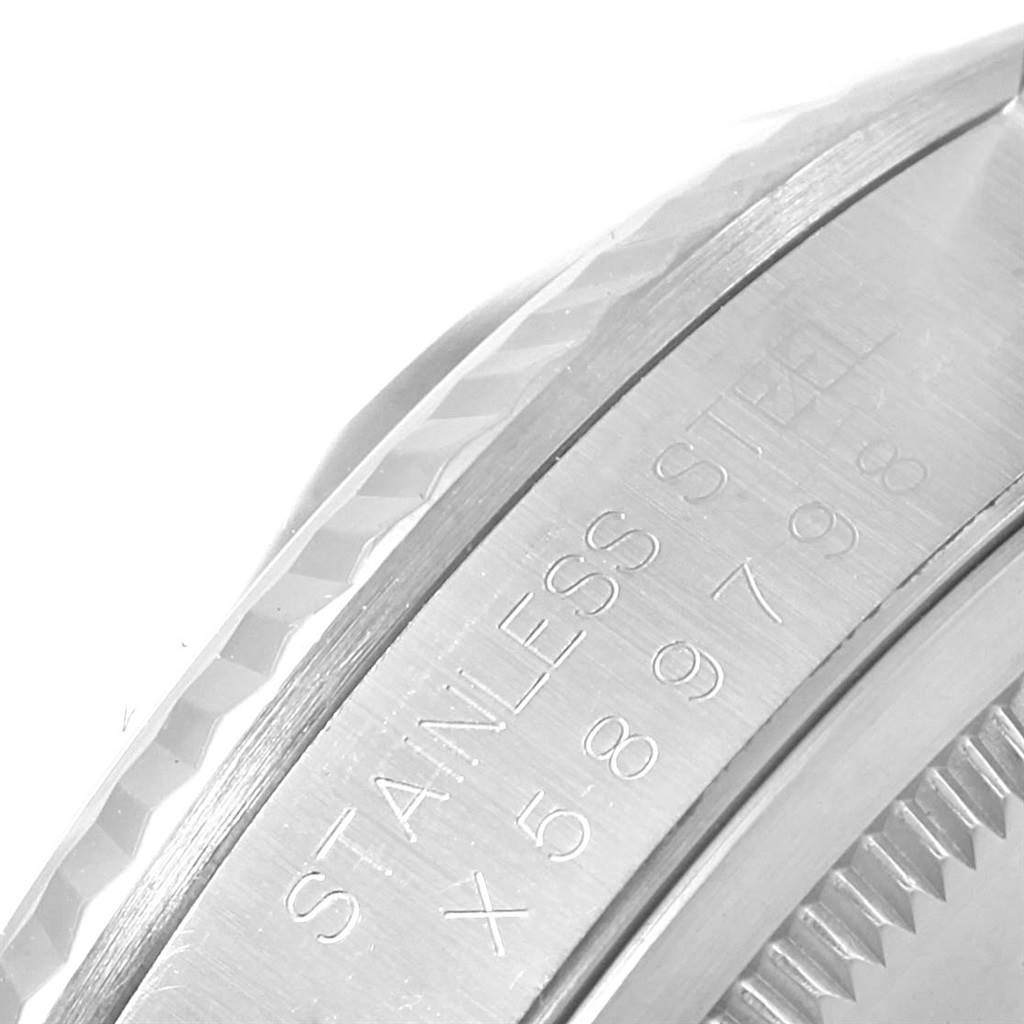 The image shows a close-up of the fluted bezel and case side with engravings on a Rolex Datejust 16234 Men's Stainless Steel Beige Dial 16234 Men's Stainless Steel Beige Dial watch.