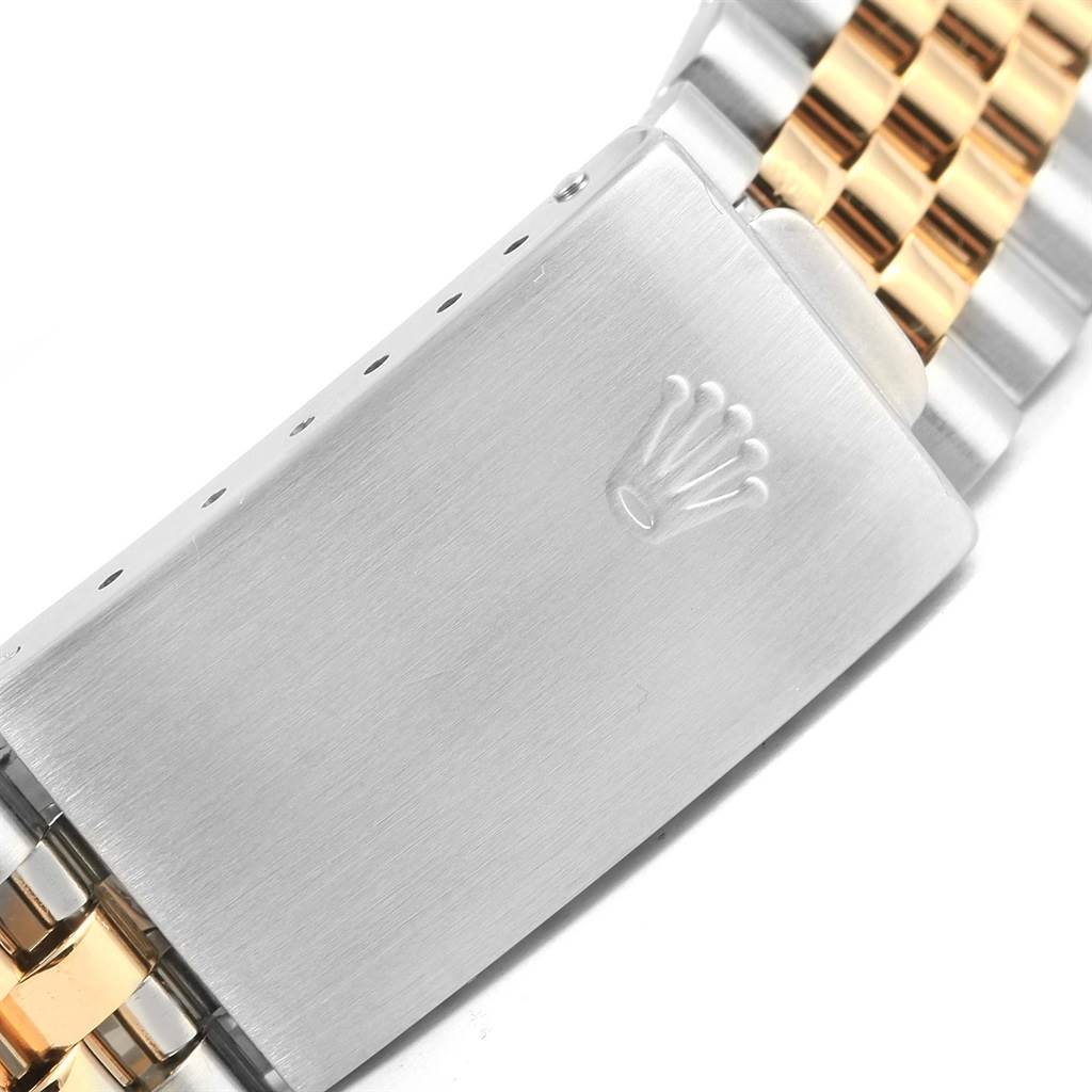 This image shows the clasp of a Rolex Datejust 16233 Steel and Gold (two tone) Champagne Dial 16233 Steel and Gold (two tone) Champagne Dial watch band, featuring stainless steel and gold links.