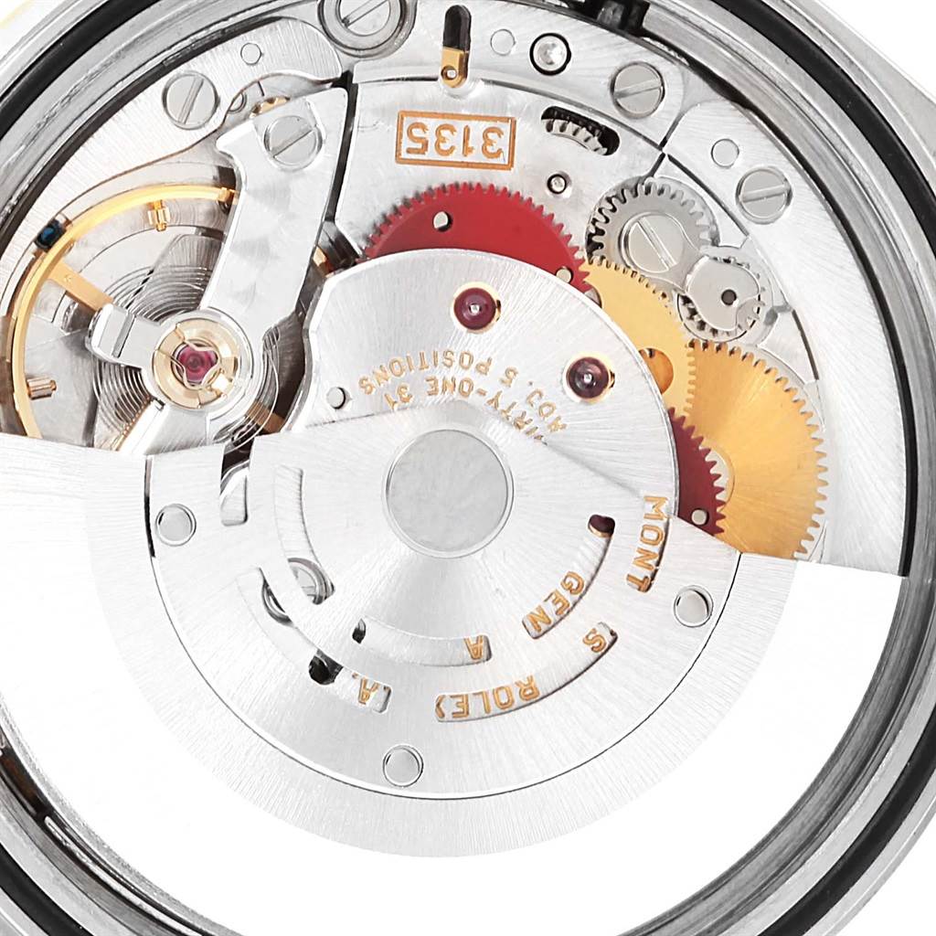 This image shows the intricate inner mechanical movement parts of a Rolex Datejust 16233 Steel and Gold (two tone) Champagne Dial 16233 Steel and Gold (two tone) Champagne Dial watch from a close-up underside angle.