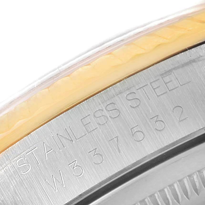 The image shows a close-up of the engraved stainless steel part of the Rolex Datejust 16233 Steel and Gold (two tone) Champagne Dial 16233 Steel and Gold (two tone) Champagne Dial watch casing.