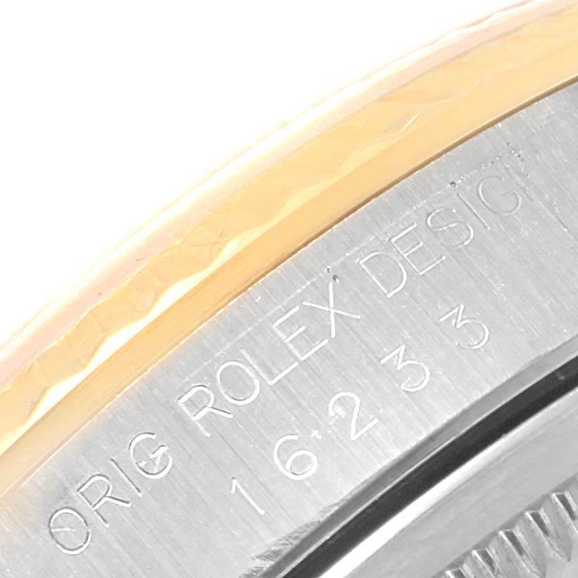 This image shows a close-up of the side of a Rolex Datejust 16233 Steel and Gold (two tone) Champagne Dial 16233 Steel and Gold (two tone) Champagne Dial watch, revealing the model number engraving.