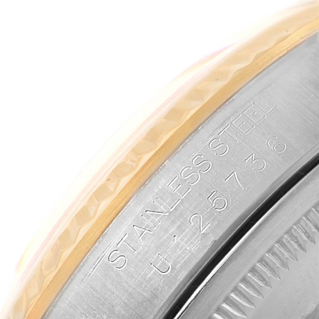 This image shows a close-up of the side engraving and fluted bezel on a Rolex Datejust 16233 Steel and Gold (two tone) Champagne Dial 16233 Steel and Gold (two tone) Champagne Dial watch.