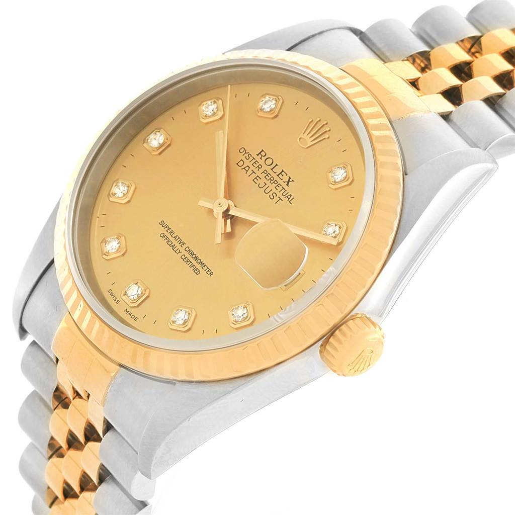 This image shows a side angle of a Rolex Datejust 16233 Steel and Gold (two tone) Champagne Dial 16233 Steel and Gold (two tone) Champagne Dial watch, highlighting its gold dial, bezel, and two-tone bracelet.