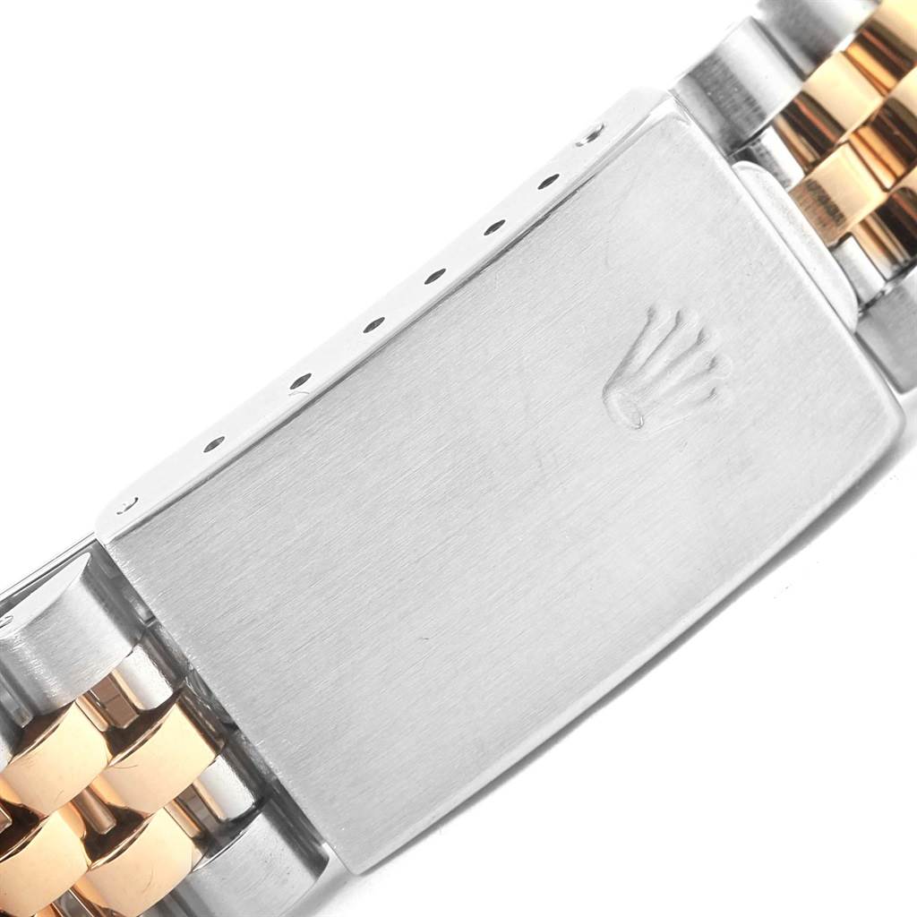 The image shows a close-up view of the bracelet clasp of a Rolex Datejust 16233 Steel and Gold (two tone) Champagne Dial 16233 Steel and Gold (two tone) Champagne Dial watch, featuring the brand's logo.