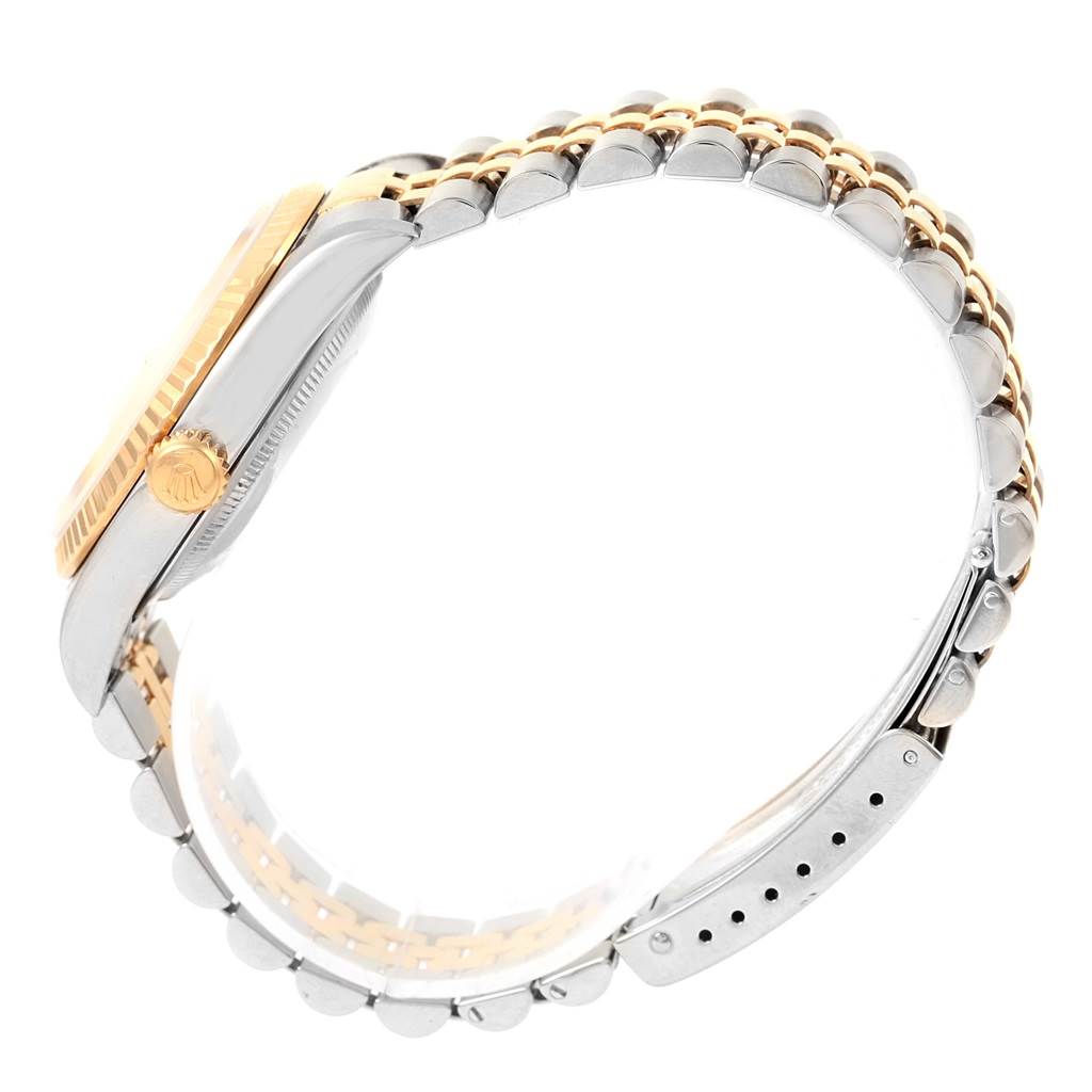 The side view of the Rolex Datejust 16233 Steel and Gold (two tone) Champagne Dial 16233 Steel and Gold (two tone) Champagne Dial watch shows the crown, case, and two-tone bracelet.