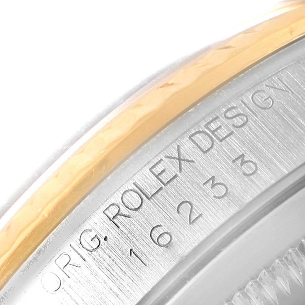 The image shows a close-up of the engraved bezel and case edge of a Rolex Datejust 16233 Steel and Gold (two tone) Champagne Dial 16233 Steel and Gold (two tone) Champagne Dial watch.