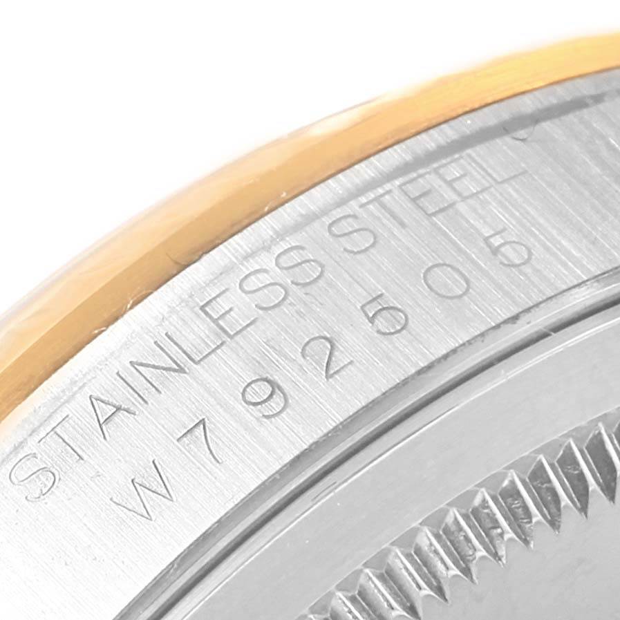 This close-up of the Rolex Datejust 16233 Men's Steel and Gold (two tone) Beige Dial 16233 Men's Steel and Gold (two tone) Beige Dial watch shows the stainless steel case and its serial number.
