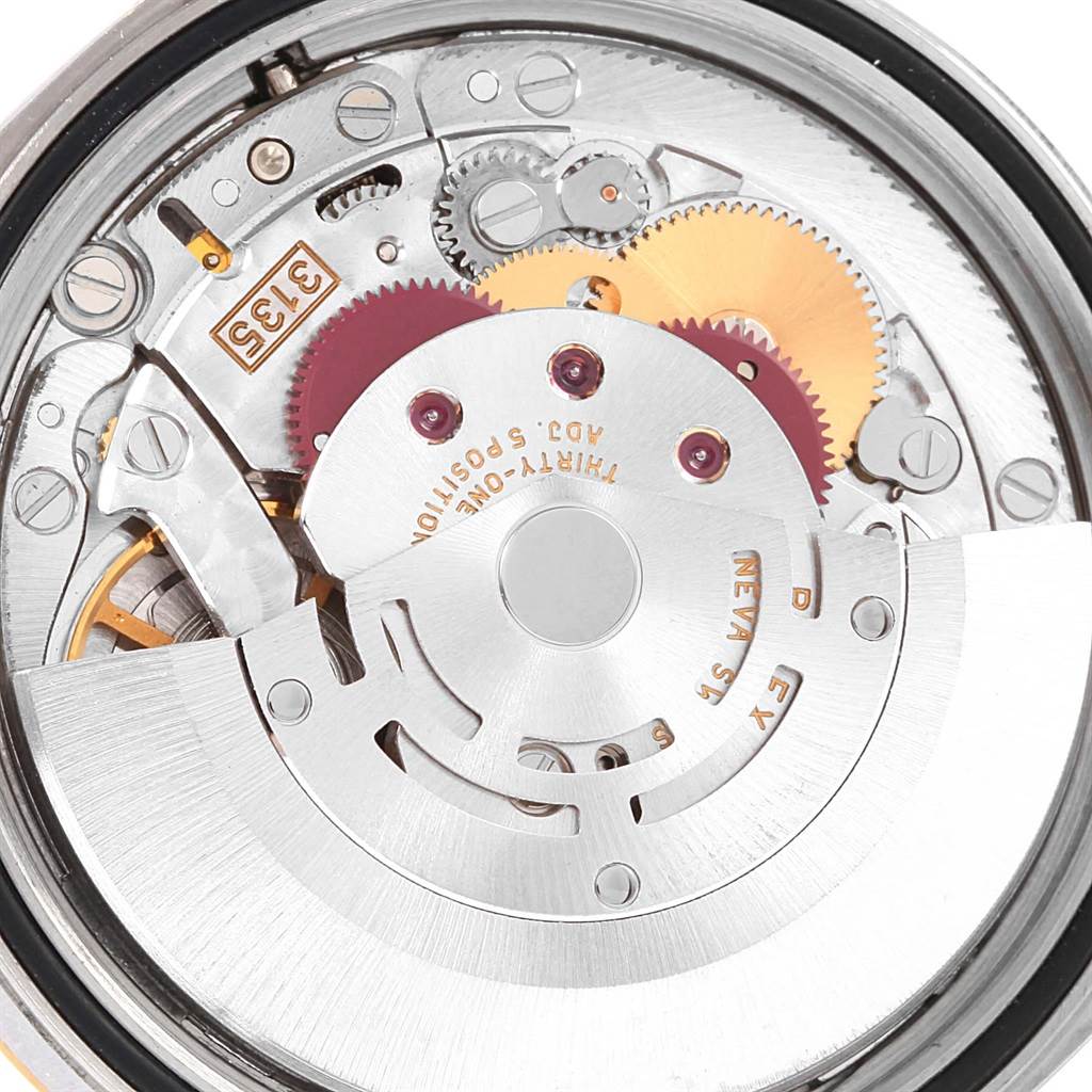 This close-up image shows the inner mechanical movement of a Rolex Datejust 16233 Men's Steel and Gold (two tone) Beige Dial 16233 Men's Steel and Gold (two tone) Beige Dial watch.