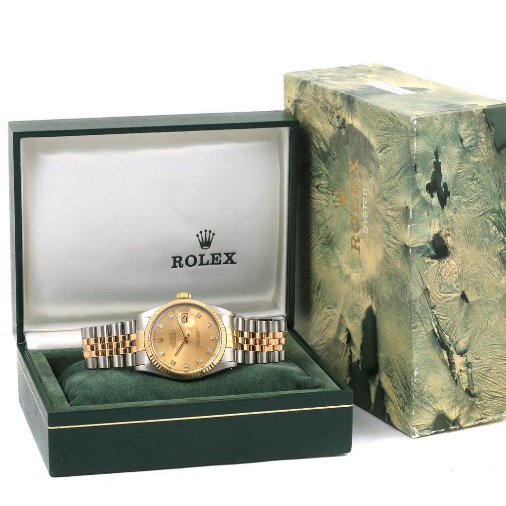 The image shows a Rolex Datejust 16013 Stainless Steel Champagne Dial 16013 Stainless Steel Champagne Dial watch in its open box, alongside the outer box.