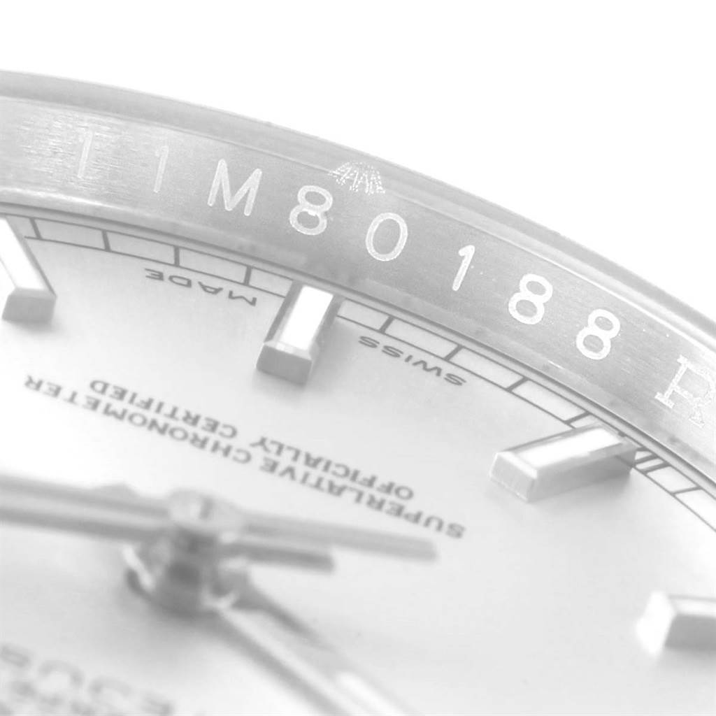 This image shows a close-up of the dial, hands, and part of the bezel of a Rolex Datejust 116200 Men's Stainless Steel Silver Dial 116200 Men's Stainless Steel Silver Dial watch.
