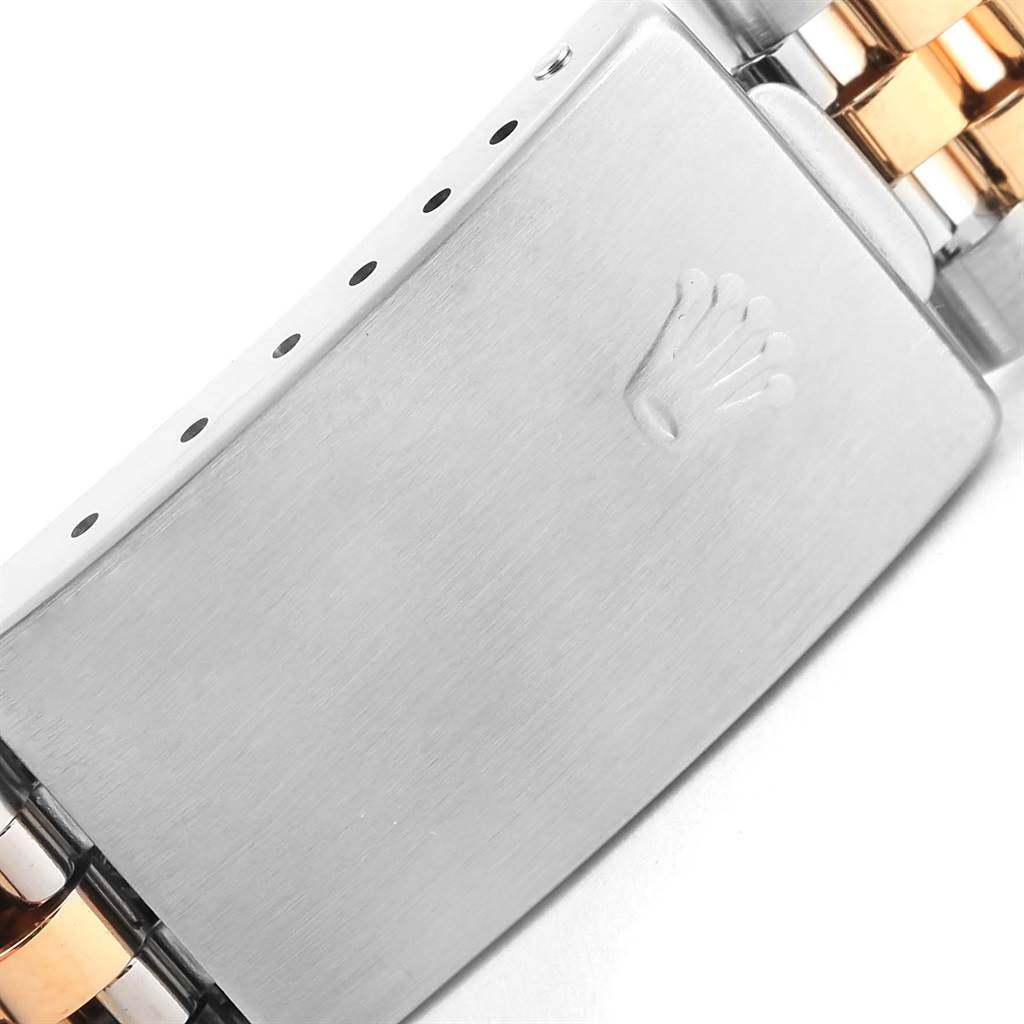 This image shows the clasp and part of the bracelet of a Rolex Datejust 16233 Steel and Gold (two tone) Champagne Dial 16233 Steel and Gold (two tone) Champagne Dial watch.