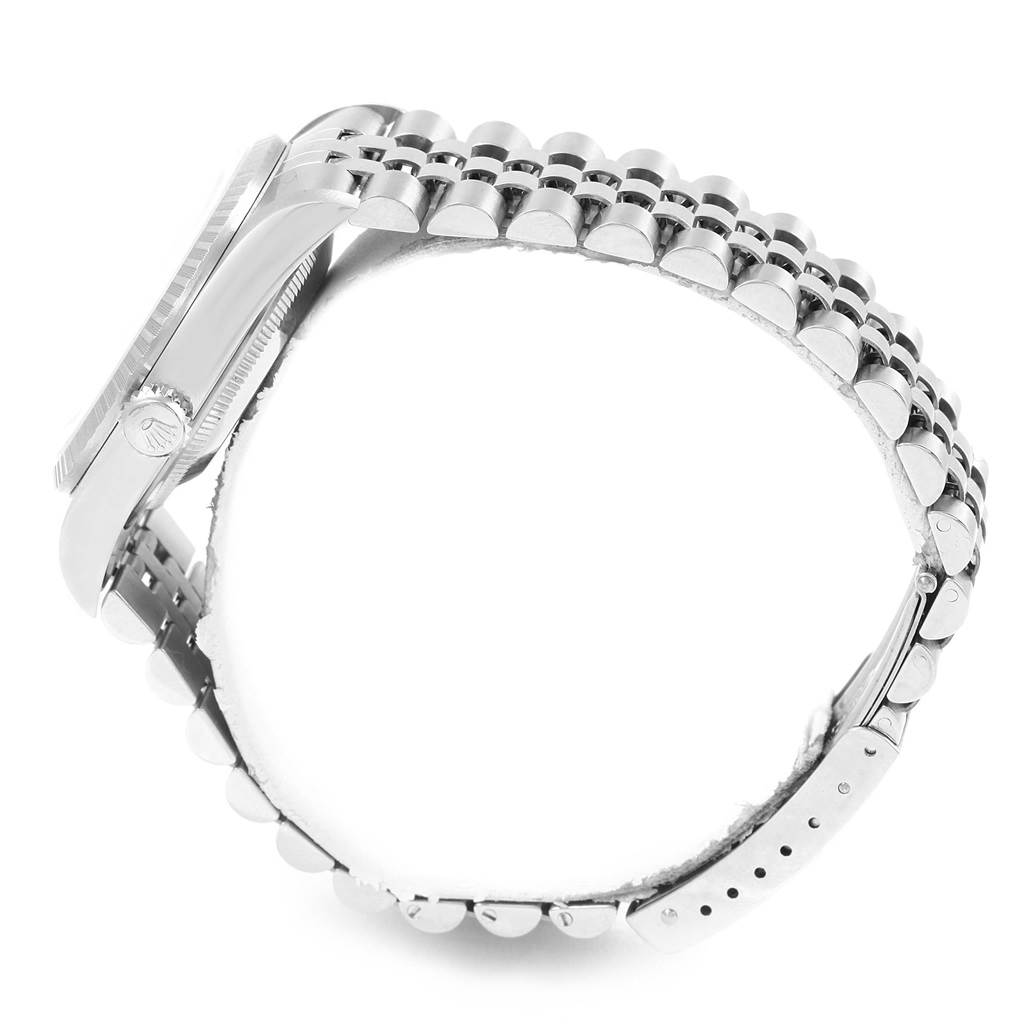 The image shows a side view of a Rolex Datejust 16220 Men's Stainless Steel Silver Dial 16220 Men's Stainless Steel Silver Dial watch with its case, crown, and bracelet visible.