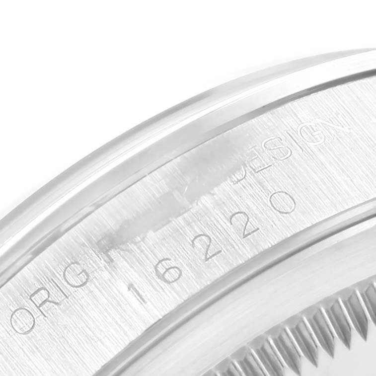 This image shows a close-up of the side engraving on the Rolex Datejust 16220 Men's Stainless Steel Silver Dial 16220 Men's Stainless Steel Silver Dial watch, displaying part of the model number.