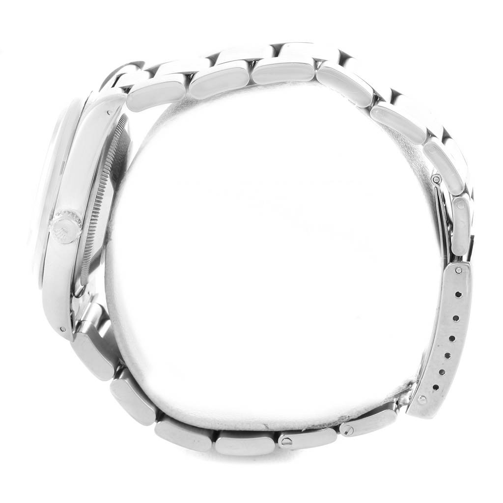 This image shows a side view of the Rolex Datejust 16220 Men's Stainless Steel Silver Dial 16220 Men's Stainless Steel Silver Dial watch, highlighting the case, crown, and bracelet links.