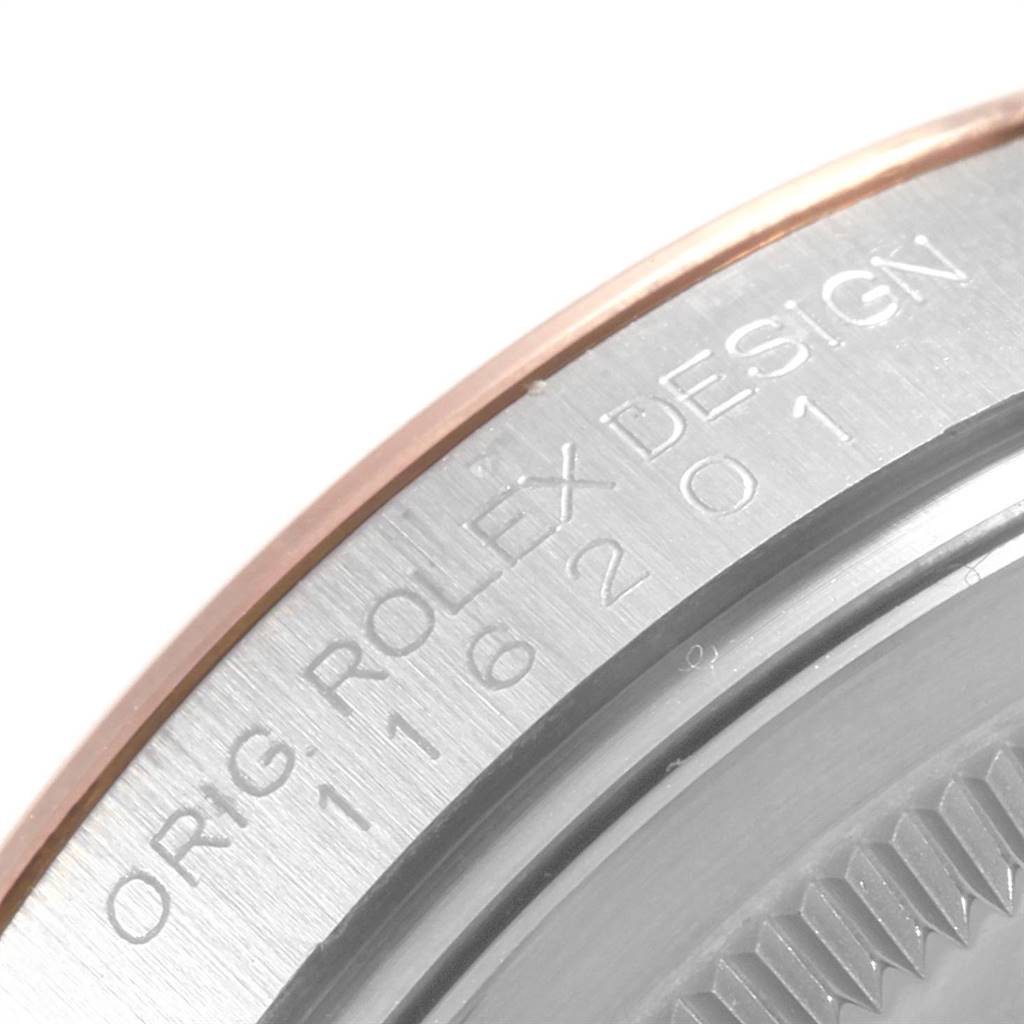 This close-up shows the bezel engravings of a Rolex Datejust 116201 Men
s Steel and Gold (two tone) Black Dial 116201 Men
s Steel and Gold (two tone) Black Dial watch, highlighting part of the model number and "ORIG ROLEX DESIGN."