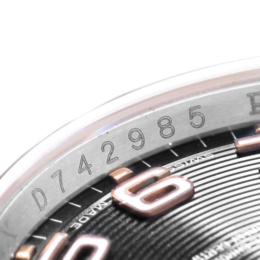 Close-up angle of the Rolex Datejust 116201 Men
s Steel and Gold (two tone) Black Dial 116201 Men
s Steel and Gold (two tone) Black Dial model showing the watch
s serial number and part of the dial with numerals.