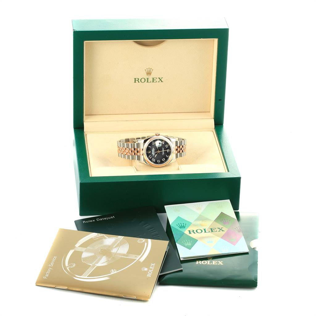 The image shows a Rolex Datejust 116201 Men
s Steel and Gold (two tone) Black Dial 116201 Men
s Steel and Gold (two tone) Black Dial watch in its open box with booklets and accessories displayed around it.