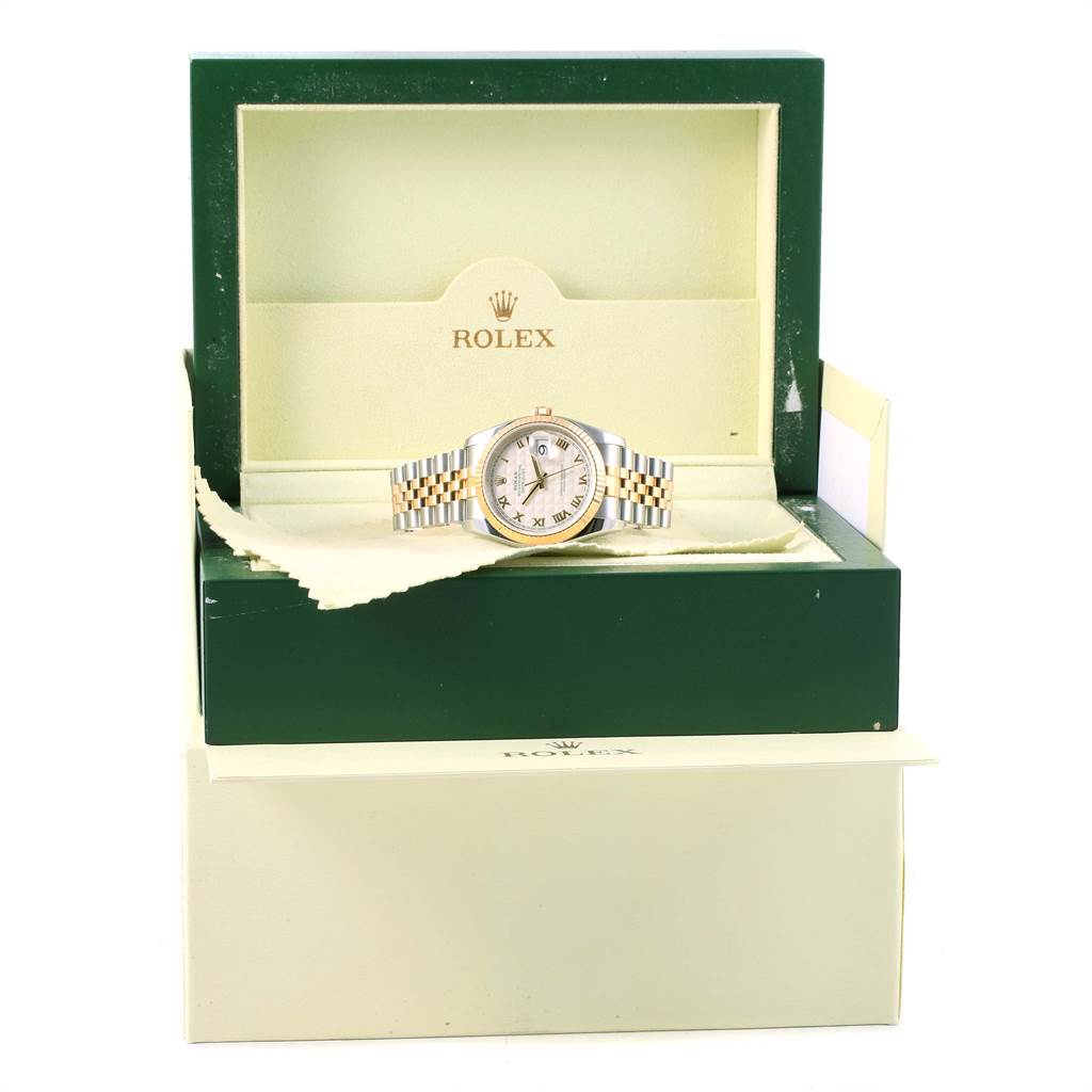 The Rolex Datejust 116233 Stainless Steel Beige Dial 116233 Stainless Steel Beige Dial watch is shown inside its green and beige box, displaying its dial and two-tone bracelet.