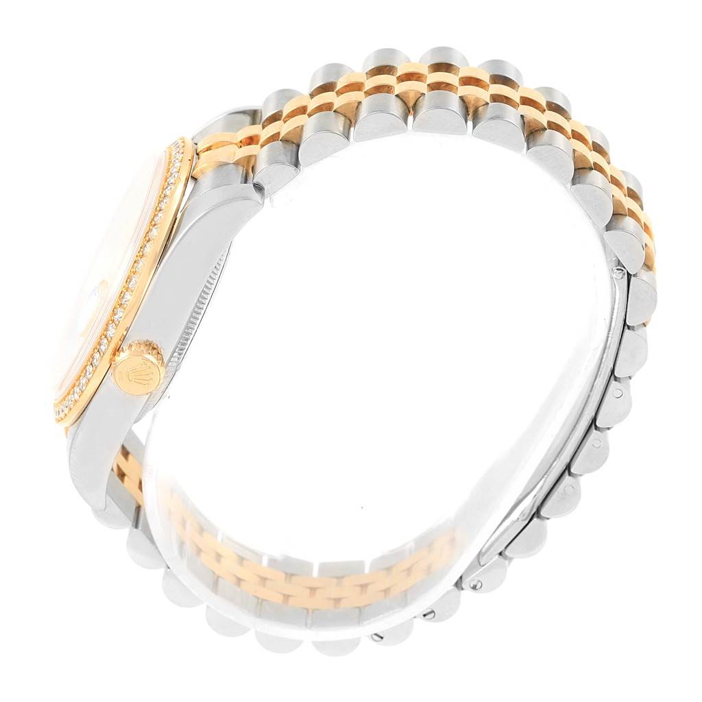 This image shows a side view of the Rolex Datejust 116243 Men's Stainless Steel Mother of Pearl Dial 116243 Men's Stainless Steel Mother of Pearl Dial watch showcasing its gold bezel and two-tone bracelet.