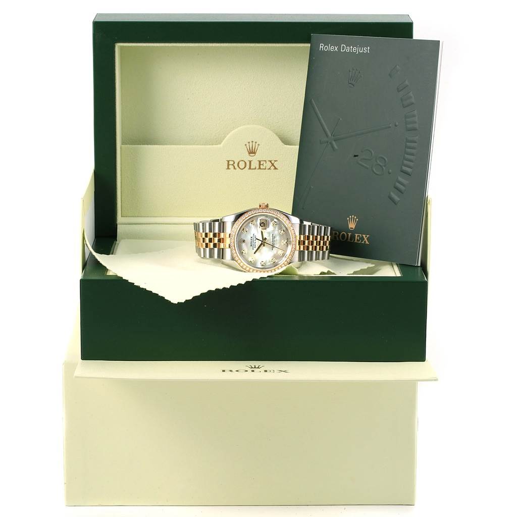 The image shows a Rolex Datejust 116243 Men's Stainless Steel Mother of Pearl Dial 116243 Men's Stainless Steel Mother of Pearl Dial watch with accessories, including the box and booklet, viewed from the front.
