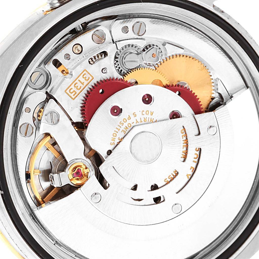 The image shows the intricate internal mechanism or movement of a Rolex Datejust 116243 Men's Stainless Steel Mother of Pearl Dial 116243 Men's Stainless Steel Mother of Pearl Dial watch from a close-up angle.