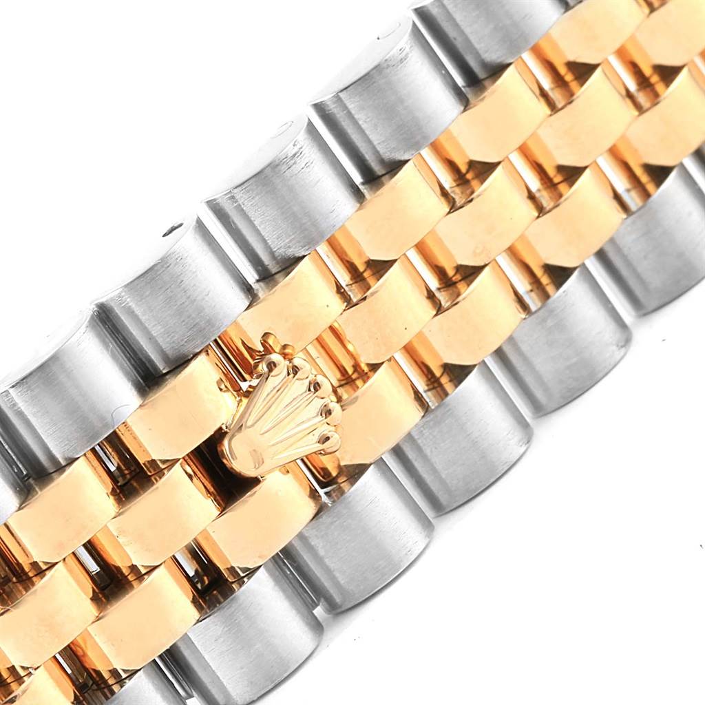 This image captures a close-up view of the Rolex Datejust 116243 Men's Stainless Steel Mother of Pearl Dial 116243 Men's Stainless Steel Mother of Pearl Dial bracelet featuring a two-tone design with the Rolex crown logo.