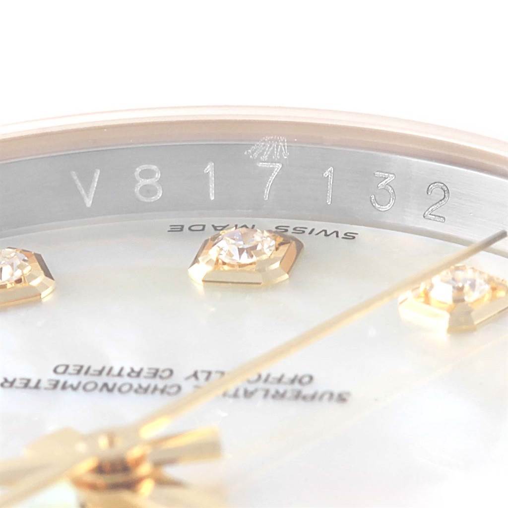 This image shows a close-up of the serial number and diamond markers on the dial of a Rolex Datejust 116243 Men's Stainless Steel Mother of Pearl Dial 116243 Men's Stainless Steel Mother of Pearl Dial watch.