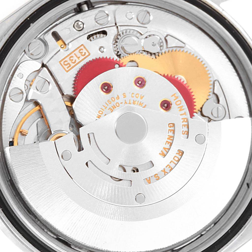 The image shows a detailed close-up view of the Rolex Datejust 16220 Men's Stainless Steel White Dial 16220 Men's Stainless Steel White Dial model's exposed mechanical movement from the back.