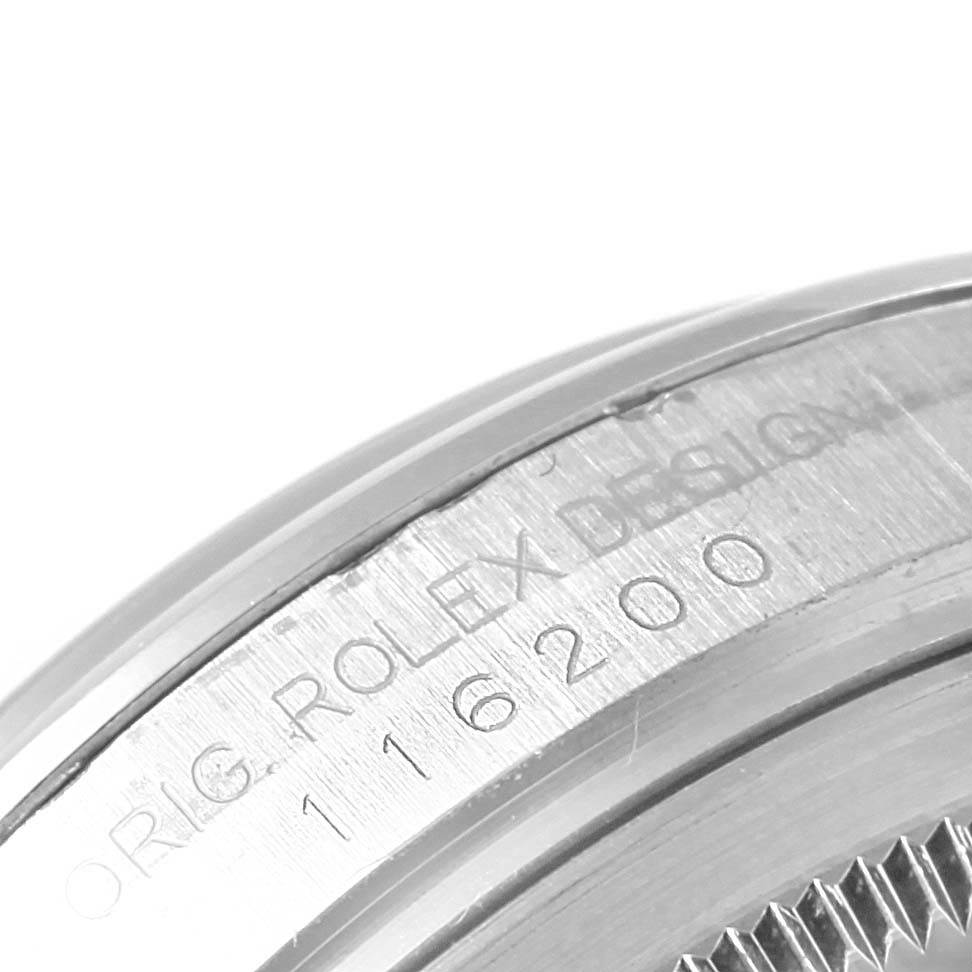 The image focuses on the side profile of the bezel with engraved text of the Rolex Datejust 116200 Men's Stainless Steel Silver Dial 116200 Men's Stainless Steel Silver Dial model.