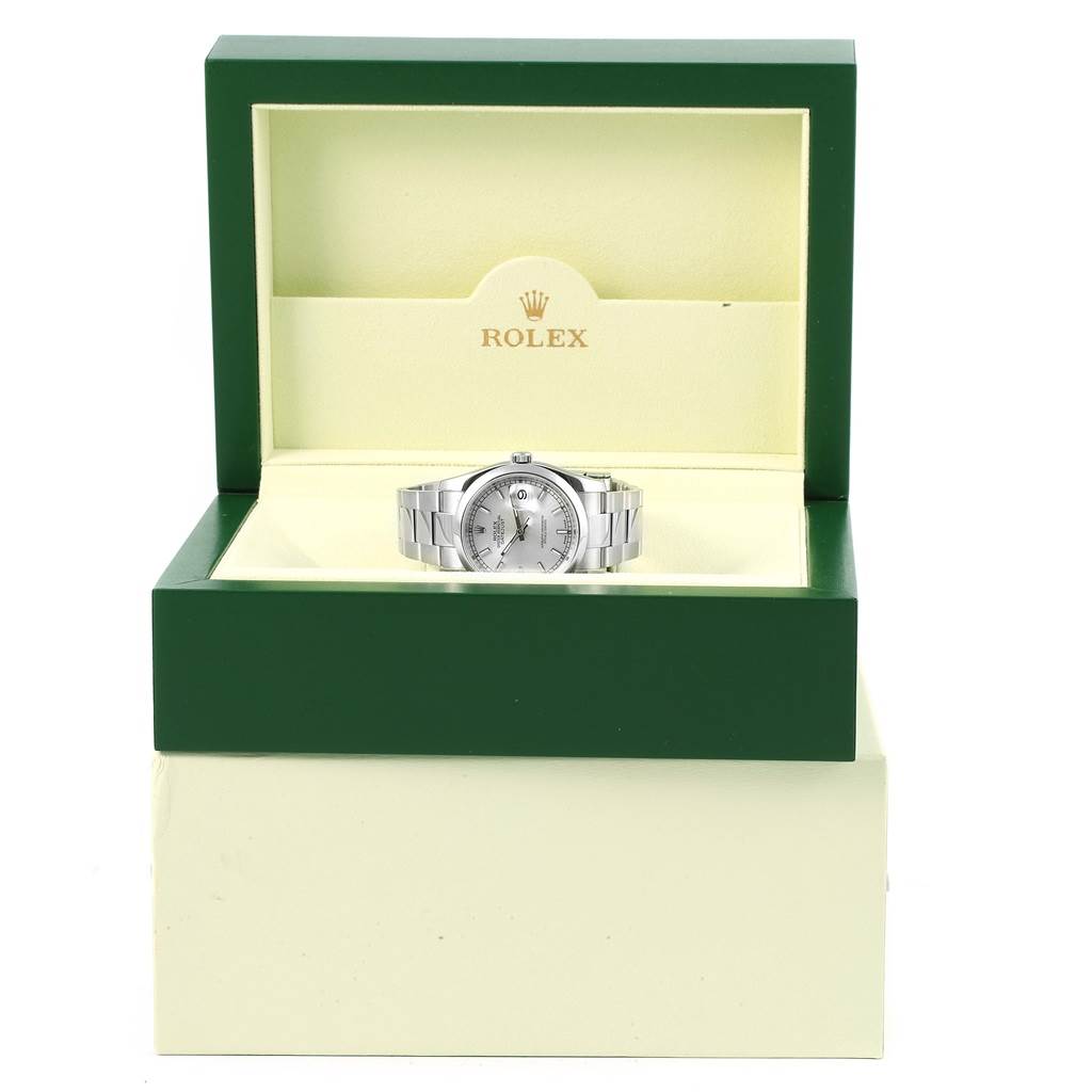 The Rolex Datejust 116200 Men's Stainless Steel Silver Dial 116200 Men's Stainless Steel Silver Dial watch is displayed frontally in its open green and beige box, showcasing its face and bracelet.