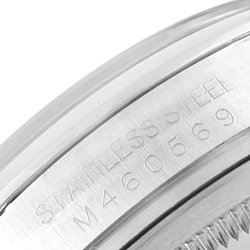 This is a close-up angle showing the stainless steel case back engraving of a Rolex Datejust 116200 Men's Stainless Steel Silver Dial 116200 Men's Stainless Steel Silver Dial watch.