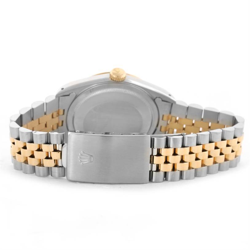 The image shows the back view of a Rolex Datejust 16233 Men's Steel and Gold (two tone) Champagne Dial 16233 Men's Steel and Gold (two tone) Champagne Dial, highlighting its case back, two-tone bracelet, and clasp.