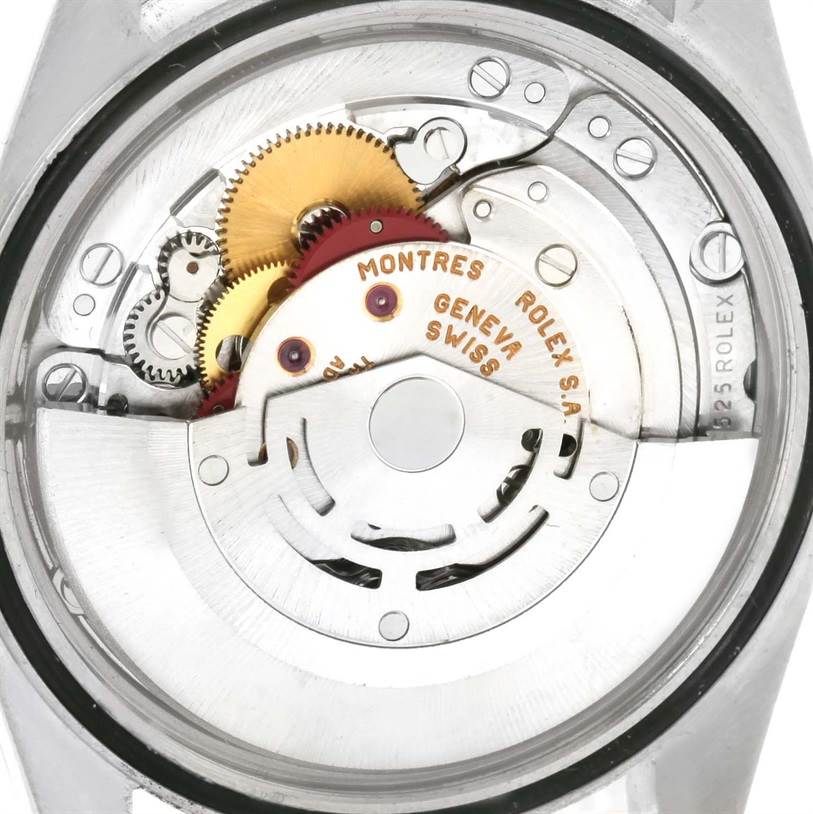 This image shows the intricate movement and internal components of a Rolex Datejust 16233 Men's Steel and Gold (two tone) Champagne Dial 16233 Men's Steel and Gold (two tone) Champagne Dial watch viewed from the back.