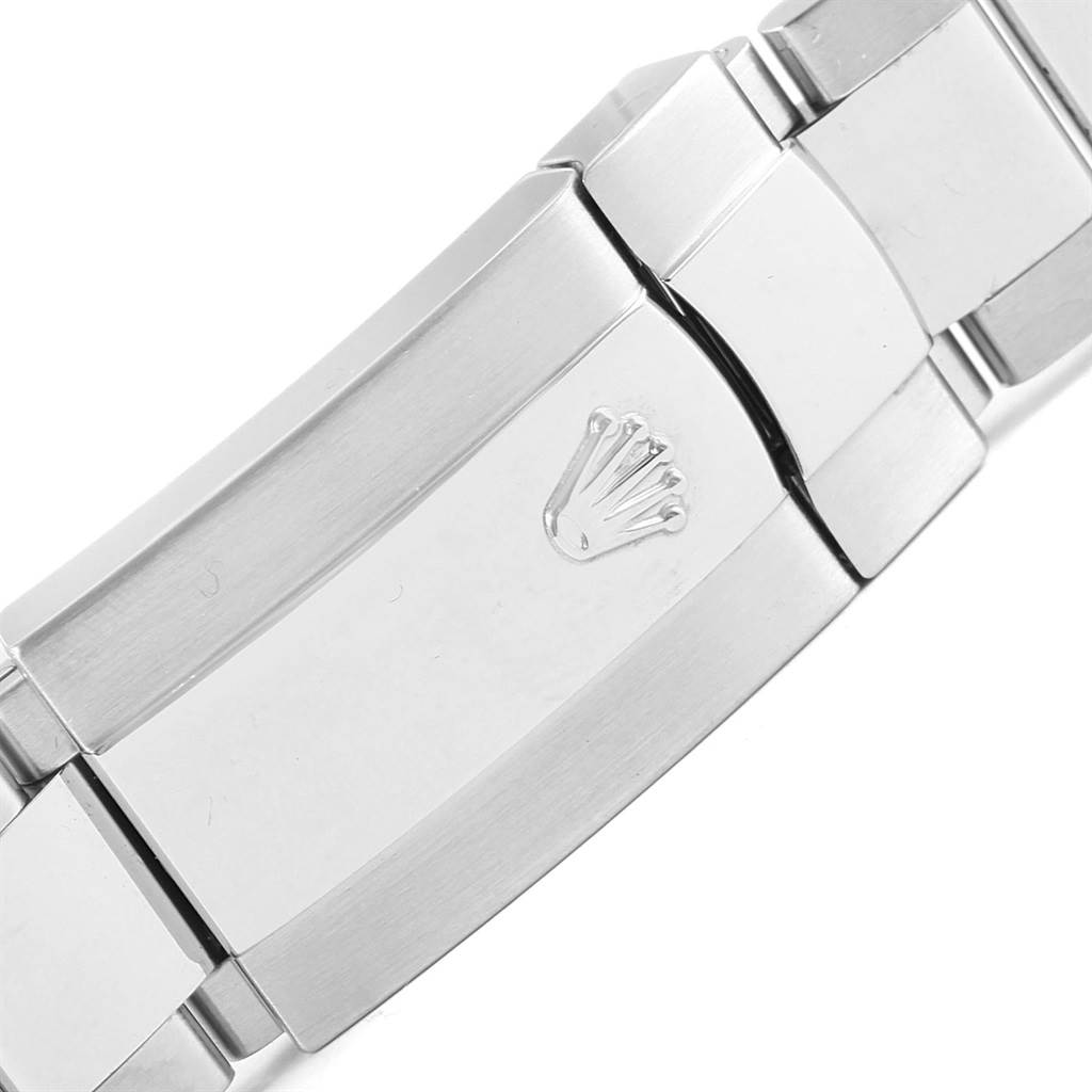 This image shows a close-up of the clasp on a Rolex Datejust 116200 Men's Stainless Steel White Dial 116200 Men's Stainless Steel White Dial watch bracelet, featuring the Rolex logo.