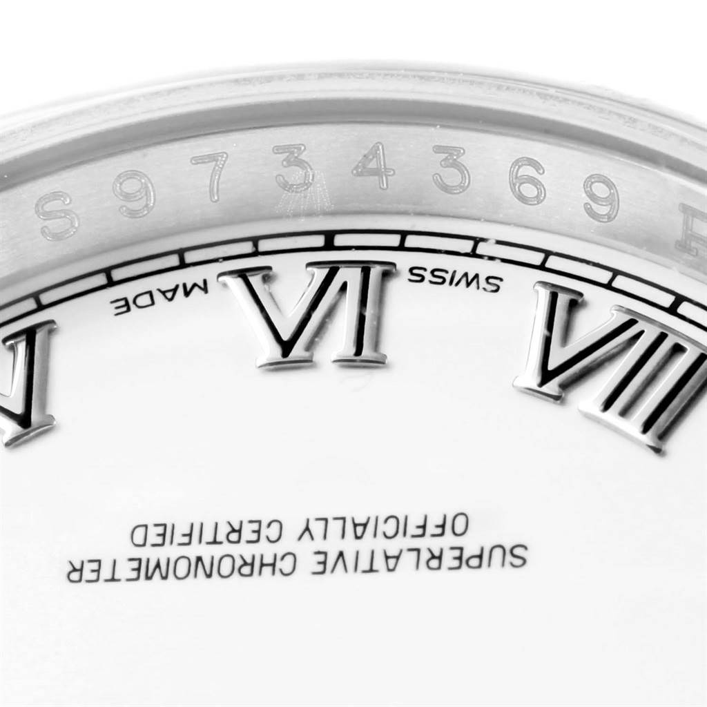 This image shows a close-up of the dial and serial number of a Rolex Datejust 116200 Men's Stainless Steel White Dial 116200 Men's Stainless Steel White Dial watch, focusing on the VI and VII hour markers.