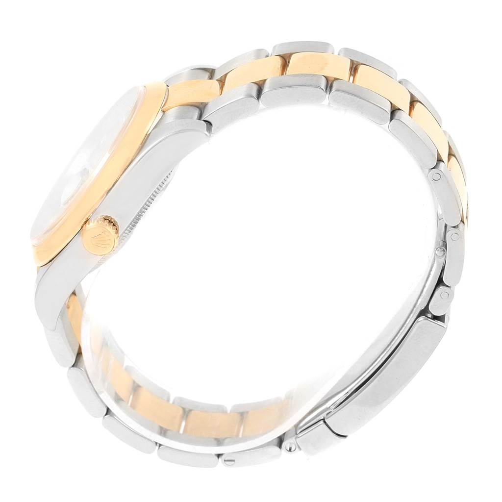 The image shows a side view of a Rolex Datejust 116203 Stainless Steel Champagne Dial 116203 Stainless Steel Champagne Dial watch, focusing on the crown, bezel, and two-tone bracelet.