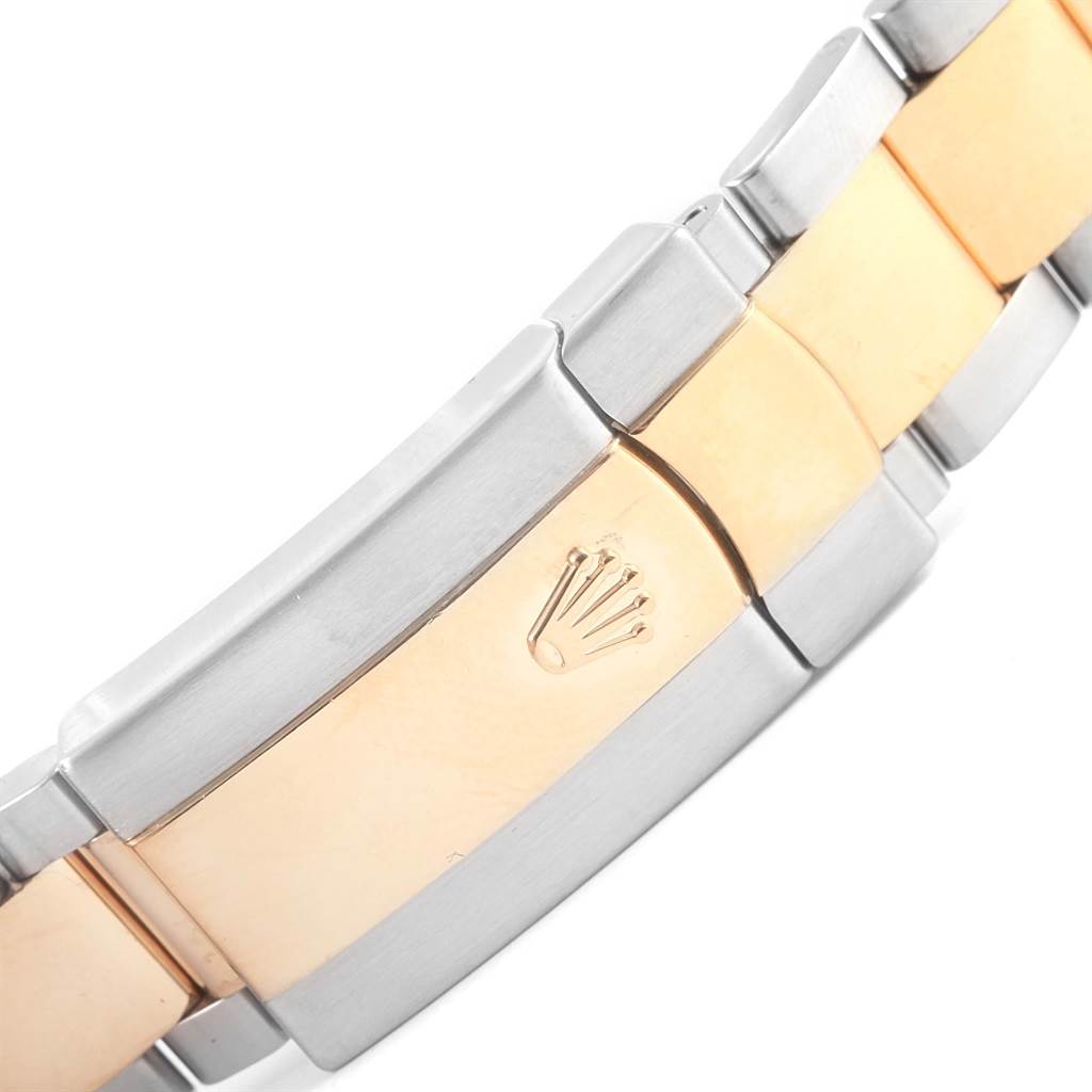 The image shows a close-up of the bi-metal bracelet clasp from a Rolex Datejust 116203 Stainless Steel Champagne Dial 116203 Stainless Steel Champagne Dial watch, featuring the Rolex crown logo.