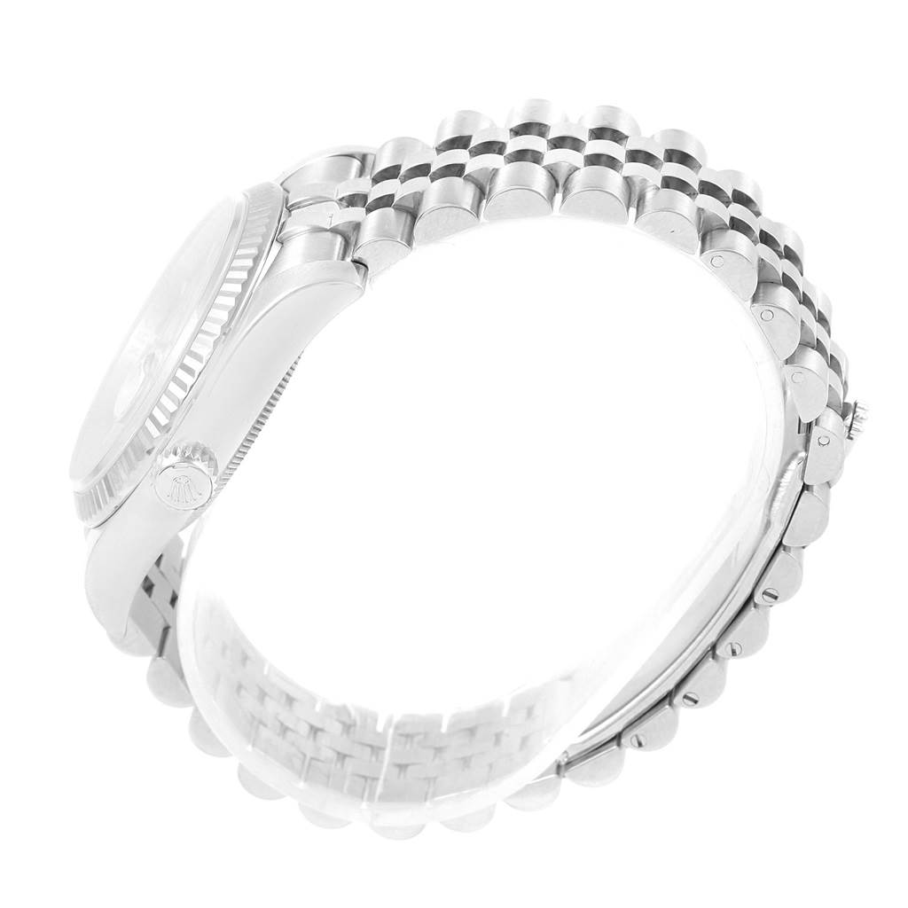 The image shows a side view of a Rolex Datejust 116234 Men's Stainless Steel Silver Dial 116234 Men's Stainless Steel Silver Dial watch, focusing on the crown and the Jubilee bracelet.