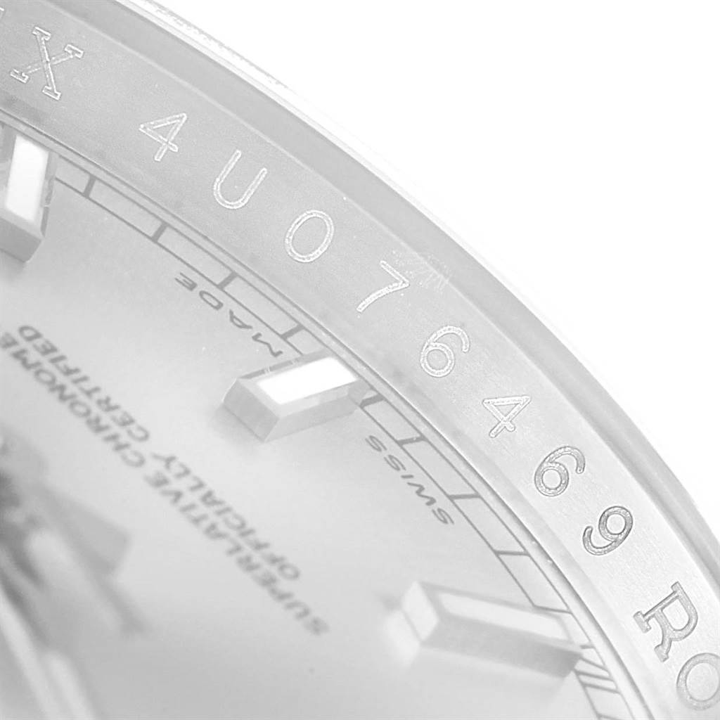 The image shows a close-up angle of the serial number and part of the dial of a Rolex Datejust 116234 Men's Stainless Steel Silver Dial 116234 Men's Stainless Steel Silver Dial model.