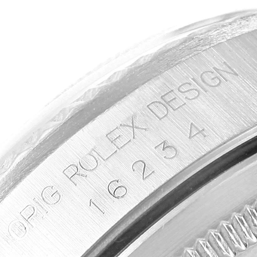 The image shows a close-up of the case back and part of the bezel for a Rolex Datejust 16234 Men's Stainless Steel White Dial 16234 Men's Stainless Steel White Dial model watch.