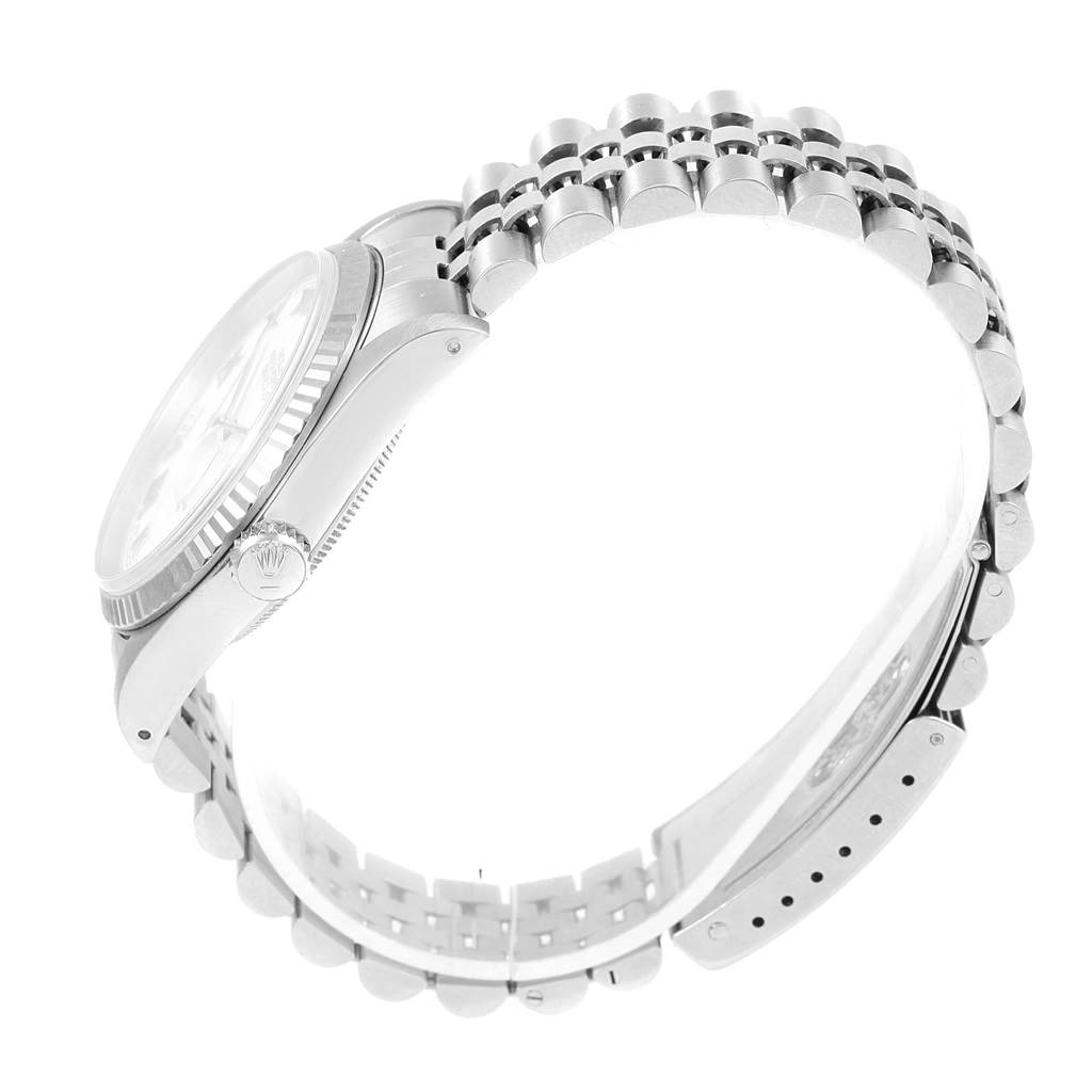 The image shows a side view of a Rolex Datejust 16234 Stainless Steel White Dial 16234 Stainless Steel White Dial watch, focusing on the bracelet, crown, and part of the case.
